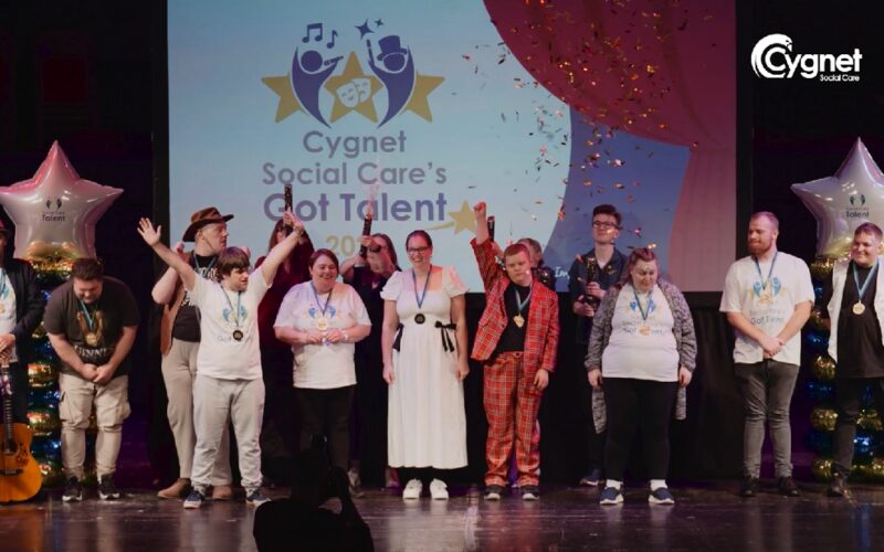 Finalists celebrating on the stage at Cygnet Social Care's Got Talent
