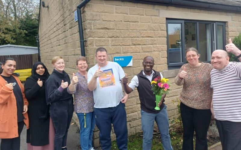Beckly staff and some of the people they support celebrating their CQC rating