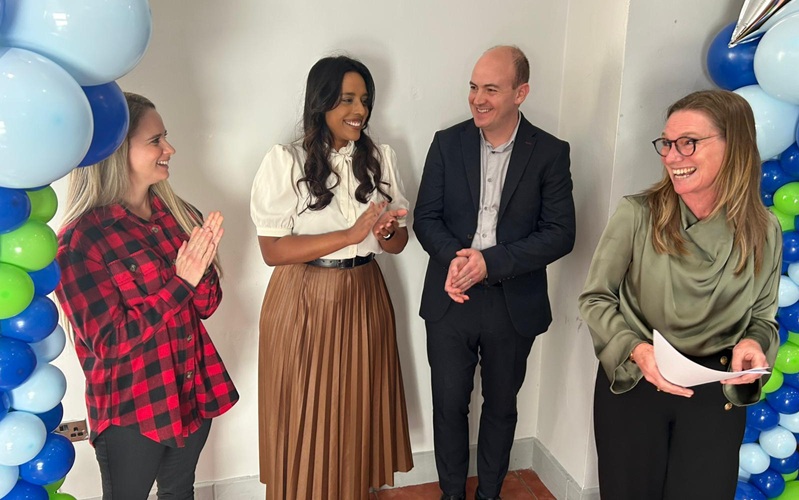 Theoca accepting the award for the team